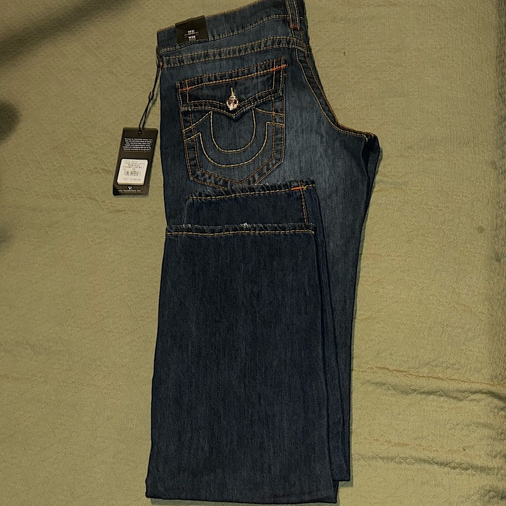 True religion low rise bootcut jeans , orange and yellow stitching - never worn